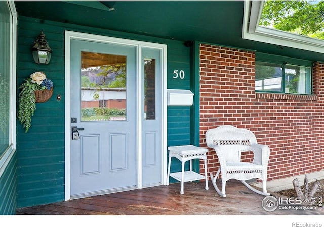 50 S 31st St, Boulder, CO 80305 - view of exterior entry featuring a porch and brick siding