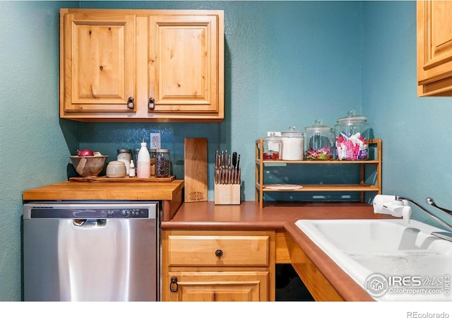 50 S 31st St, Boulder, CO 80305 - kitchen with stainless steel dishwasher, a sink, light brown cabinets, and a textured wall