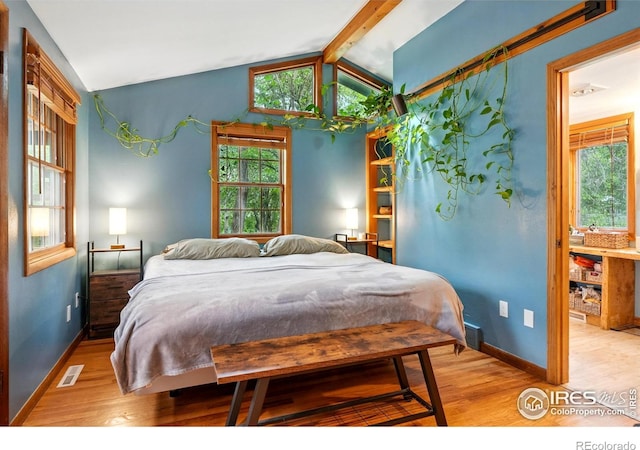 50 S 31st St, Boulder, CO 80305 - bedroom with wood finished floors, multiple windows, and baseboards