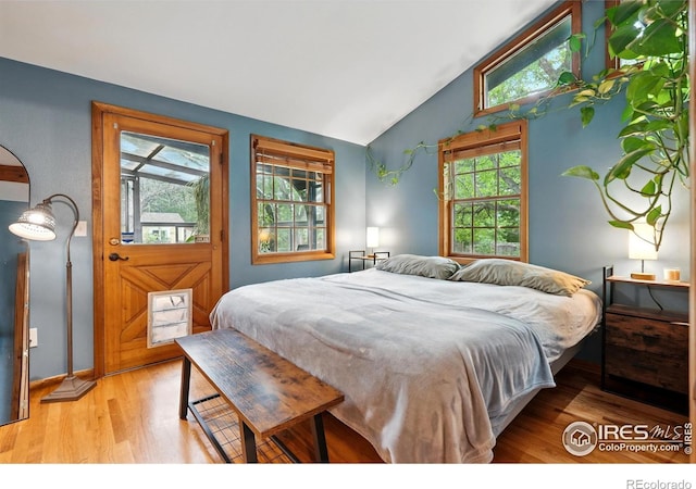 50 S 31st St, Boulder, CO 80305 - bedroom featuring light wood finished floors, multiple windows, baseboards, and high vaulted ceiling
