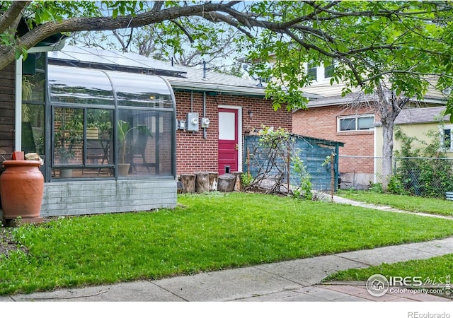 50 S 31st St, Boulder, CO 80305 - view of front facade featuring brick siding and a sunroom