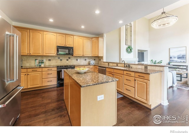 2204 Lasalle St, Superior, CO 80027 - kitchen with black appliances, a sink, light brown cabinetry, a peninsula, and recessed lighting