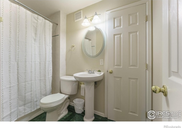 2204 Lasalle St, Superior, CO 80027 - bathroom featuring toilet, a shower with shower curtain, tile patterned flooring, baseboards, and a sink
