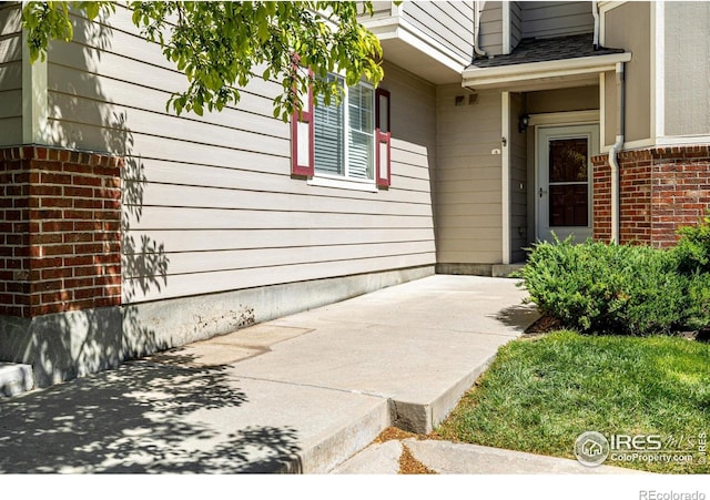 13024 Grant Cir W Unit A, Thornton, CO 80241 - entrance to property with brick siding and a patio area