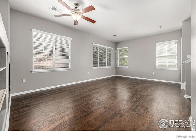 13024 Grant Cir W Unit A, Thornton, CO 80241 - empty room featuring a ceiling fan, dark wood-type flooring, and baseboards