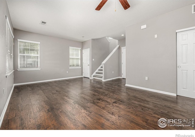 13024 Grant Cir W Unit A, Thornton, CO 80241 - empty room featuring ceiling fan, wood finished floors, stairs, and healthy amount of natural light