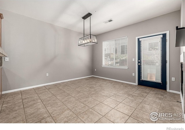 13024 Grant Cir W Unit A, Thornton, CO 80241 - unfurnished dining area with light tile patterned floors and baseboards