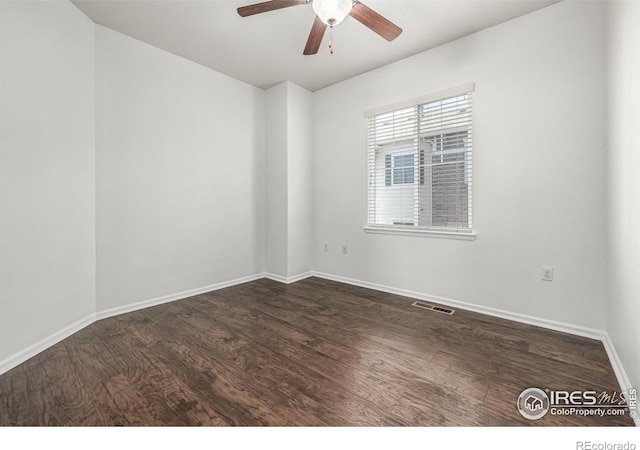 13024 Grant Cir W Unit A, Thornton, CO 80241 - spare room featuring a ceiling fan, dark wood finished floors, and baseboards