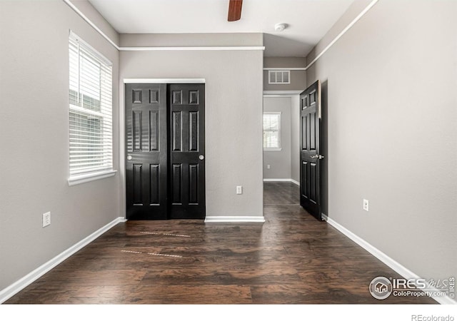 13024 Grant Cir W Unit A, Thornton, CO 80241 - unfurnished bedroom with wood finished floors, baseboards, a ceiling fan, and a closet
