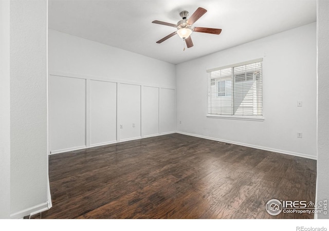 13024 Grant Cir W Unit A, Thornton, CO 80241 - unfurnished room with ceiling fan, dark wood-type flooring, and baseboards