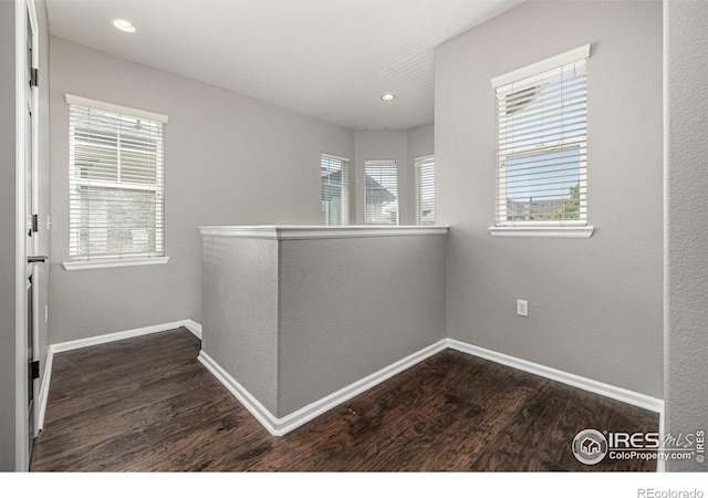 13024 Grant Cir W Unit A, Thornton, CO 80241 - hallway with dark wood-style floors, baseboards, and recessed lighting