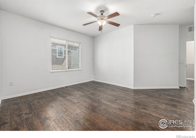13024 Grant Cir W Unit A, Thornton, CO 80241 - empty room featuring a ceiling fan, dark wood-type flooring, baseboards, and a smoke detector