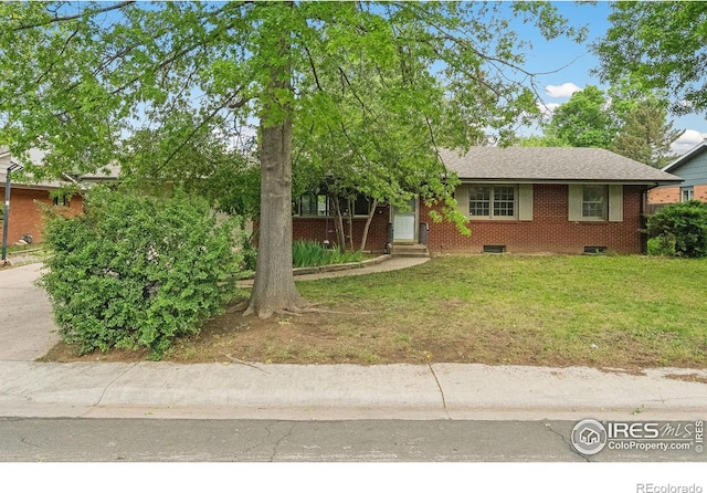 1200 Emigh St, Fort Collins, CO 80524 - view of front of property with brick siding, a front lawn, a shingled roof, and entry steps