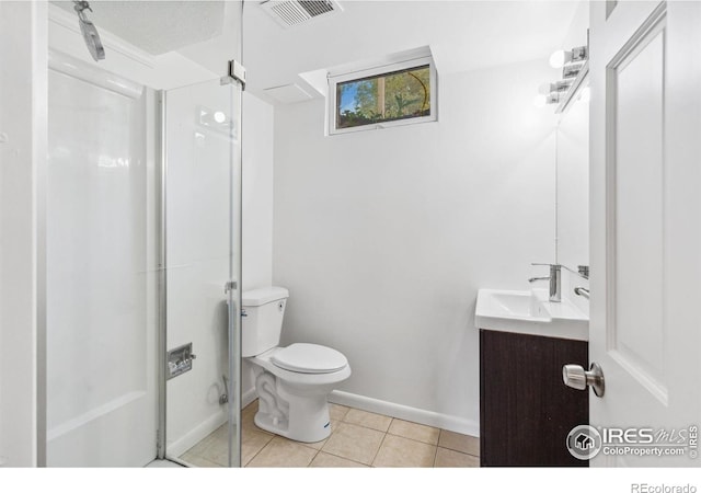 1200 Emigh St, Fort Collins, CO 80524 - bathroom featuring vanity, toilet, tile patterned floors, baseboards, and a shower