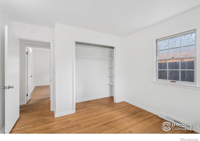 1200 Emigh St, Fort Collins, CO 80524 - unfurnished bedroom with light wood-type flooring, a closet, and baseboards