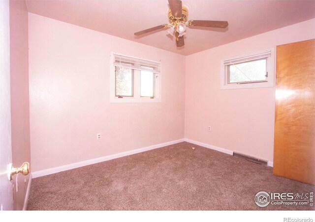 815 Park St, Fort Morgan, CO 80701 - spare room featuring carpet flooring, plenty of natural light, and a ceiling fan