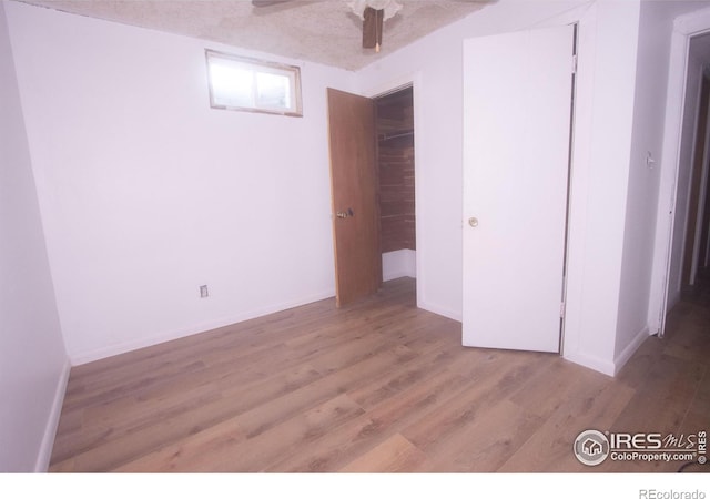 815 Park St, Fort Morgan, CO 80701 - unfurnished bedroom featuring wood finished floors, baseboards, and a ceiling fan