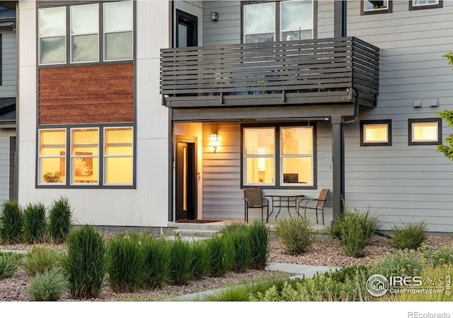 2086 Autumn Moon Dr Unit 7, Windsor, CO 80550 - rear view of house with a balcony and covered porch