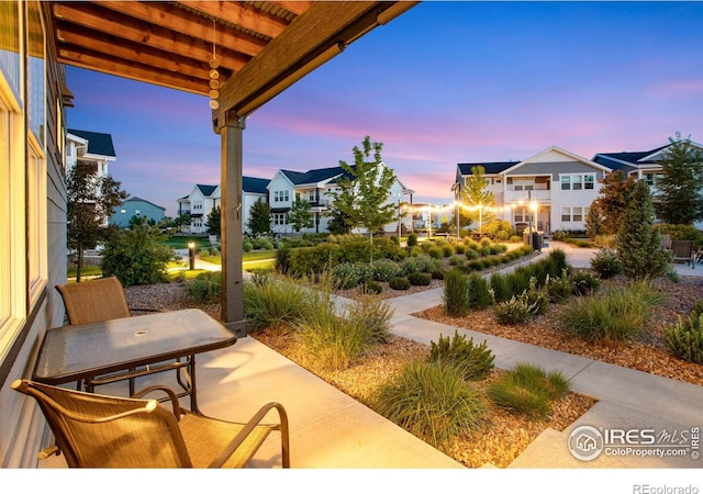 2086 Autumn Moon Dr Unit 7, Windsor, CO 80550 - patio terrace at dusk with a residential view
