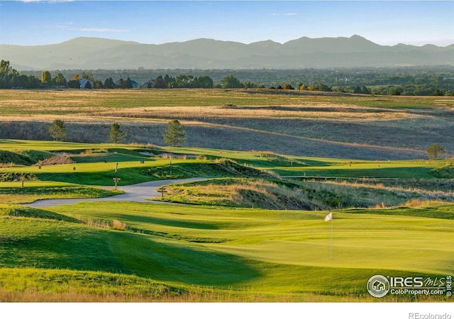2086 Autumn Moon Dr Unit 7, Windsor, CO 80550 - view of community featuring a mountain view, golf course view, and a putting area