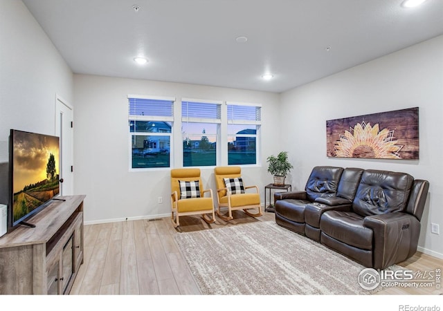 2086 Autumn Moon Dr Unit 7, Windsor, CO 80550 - living area with light wood-style flooring, recessed lighting, and baseboards
