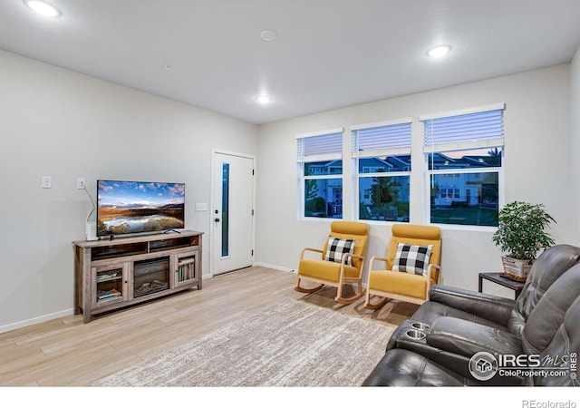 2086 Autumn Moon Dr Unit 7, Windsor, CO 80550 - living room with baseboards, wood finished floors, and recessed lighting