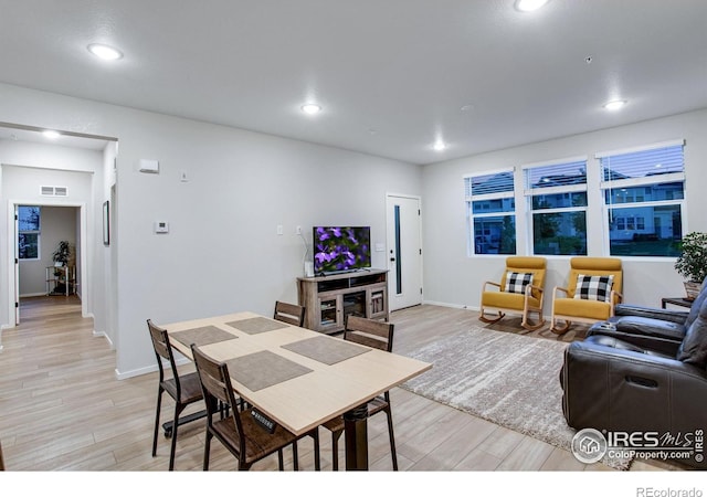 2086 Autumn Moon Dr Unit 7, Windsor, CO 80550 - living room with light wood finished floors, recessed lighting, and baseboards
