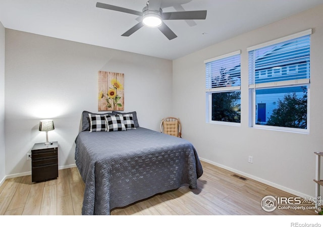 2086 Autumn Moon Dr Unit 7, Windsor, CO 80550 - bedroom featuring wood finished floors, baseboards, and a ceiling fan
