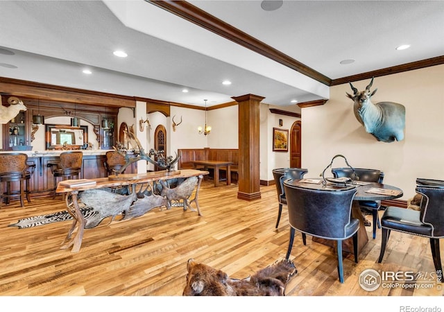 20360 County Road 3, Berthoud, CO 80513 - dining space with crown molding, wood finished floors, ornate columns, wainscoting, and recessed lighting