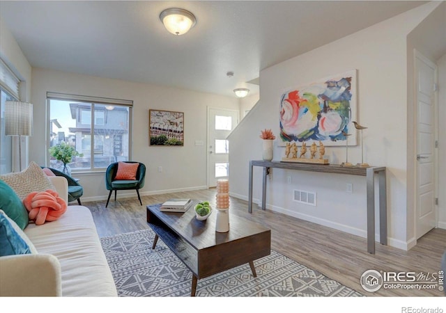 5863 Boston St, Denver, CO 80238 - living room featuring wood finished floors and baseboards