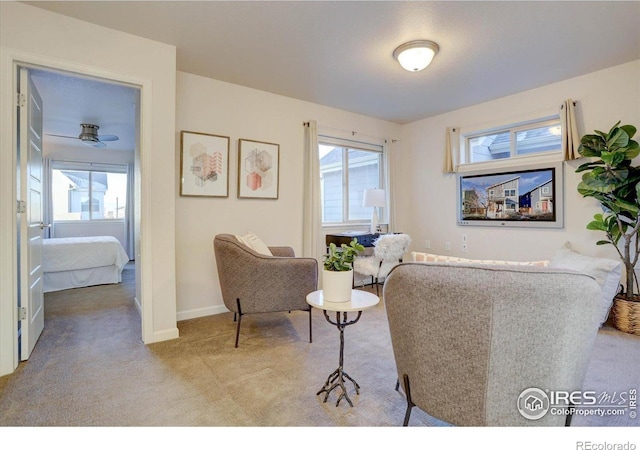 5863 Boston St, Denver, CO 80238 - carpeted living area with healthy amount of natural light and baseboards