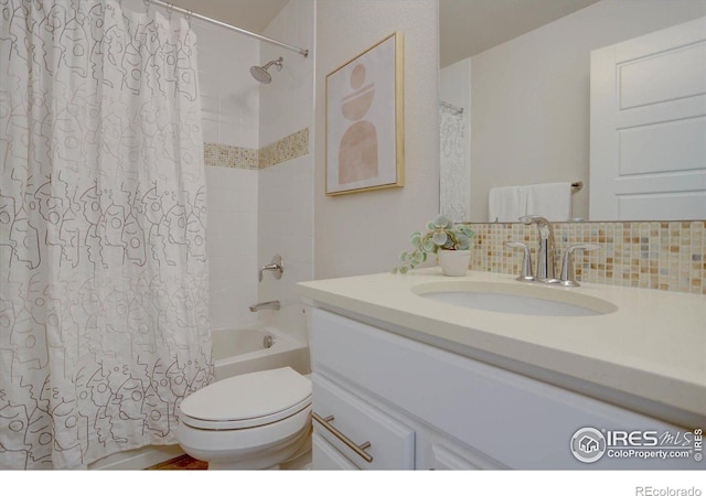 5863 Boston St, Denver, CO 80238 - bathroom with vanity, shower / bath combination with curtain, toilet, and backsplash