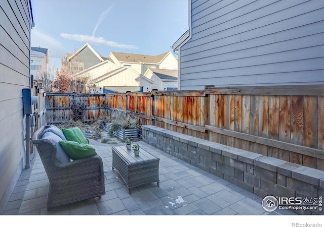 5863 Boston St, Denver, CO 80238 - fenced backyard with a patio area and outdoor lounge area