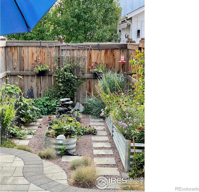 5863 Boston St, Denver, CO 80238 - view of yard with a vegetable garden