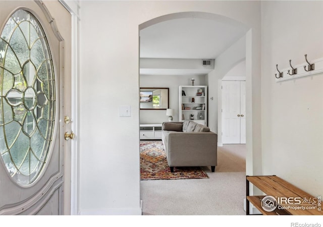 820 Kimbark St Unit D, Longmont, CO 80501 - carpeted foyer entrance with arched walkways