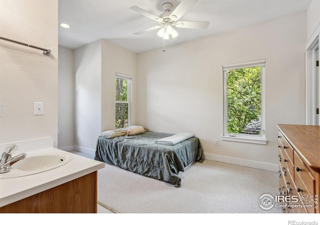 820 Kimbark St Unit D, Longmont, CO 80501 - bedroom featuring a sink, carpet floors, baseboards, ceiling fan, and recessed lighting