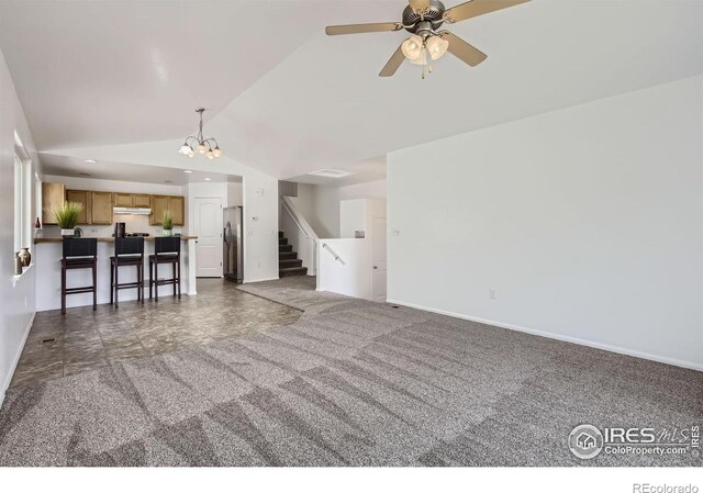2220 Woodbury Ln, Fort Collins, CO 80524 - unfurnished living room with lofted ceiling, stairway, carpet floors, a chandelier, and baseboards
