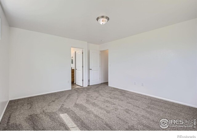 2220 Woodbury Ln, Fort Collins, CO 80524 - empty room with carpet floors and baseboards