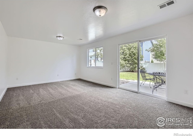 2220 Woodbury Ln, Fort Collins, CO 80524 - unfurnished room featuring carpet floors, healthy amount of natural light, and baseboards