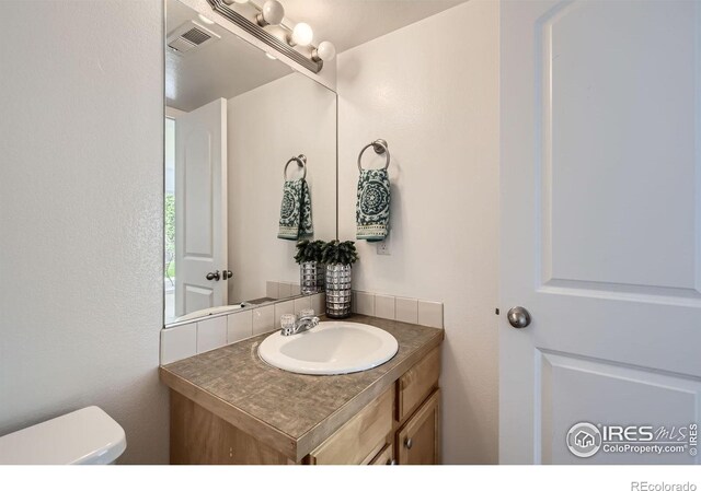 2220 Woodbury Ln, Fort Collins, CO 80524 - bathroom featuring vanity and toilet