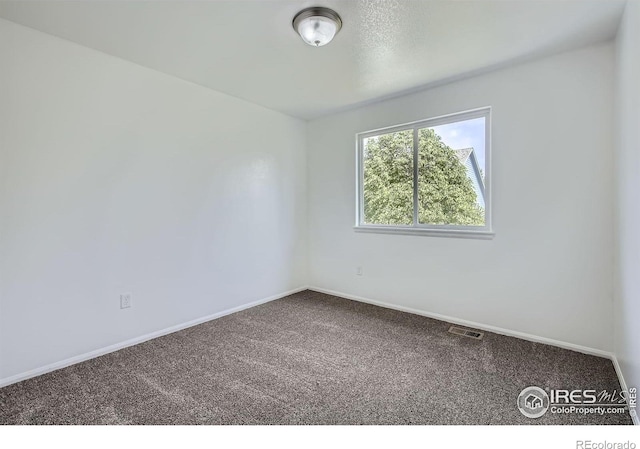 2220 Woodbury Ln, Fort Collins, CO 80524 - carpeted spare room featuring baseboards