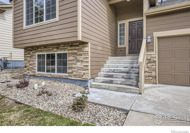 2220 Woodbury Ln, Fort Collins, CO 80524 - entrance to property featuring stone siding