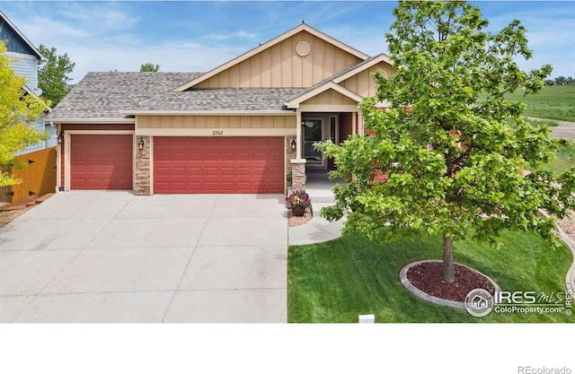 2767 Stallion Way, Mead, CO 80542 - craftsman-style house with an attached garage, board and batten siding, concrete driveway, a front lawn, and a shingled roof