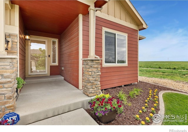 2767 Stallion Way, Mead, CO 80542 - view of exterior entry featuring board and batten siding and stone siding