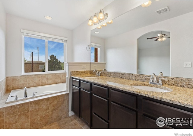 2767 Stallion Way, Mead, CO 80542 - full bathroom featuring double vanity, a bath, ceiling fan, recessed lighting, and tile patterned flooring