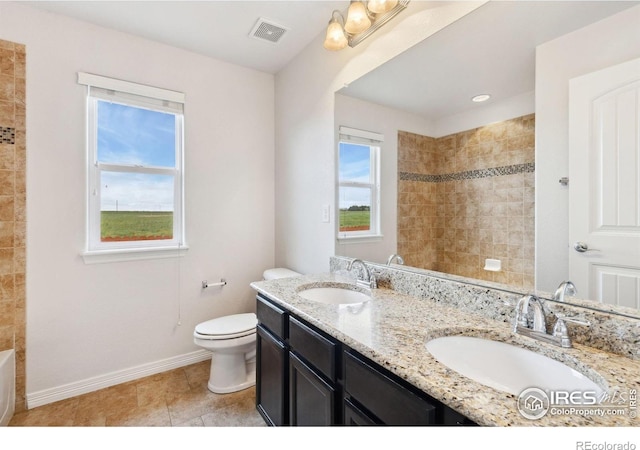 2767 Stallion Way, Mead, CO 80542 - full bath featuring double vanity, toilet, and baseboards