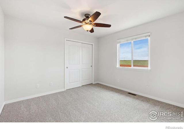 2767 Stallion Way, Mead, CO 80542 - unfurnished bedroom with carpet flooring, baseboards, a closet, and a ceiling fan