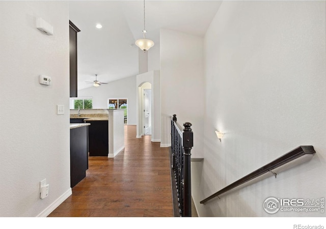 2767 Stallion Way, Mead, CO 80542 - stairs featuring wood finished floors, ceiling fan, baseboards, and arched walkways