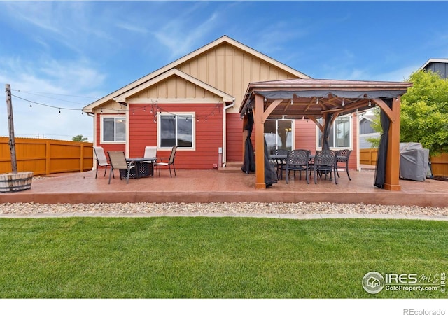2767 Stallion Way, Mead, CO 80542 - back of property with a gazebo, board and batten siding, and a patio area