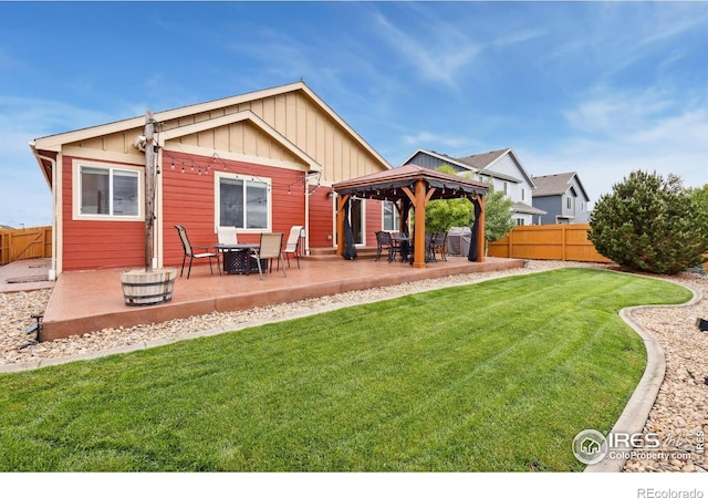 2767 Stallion Way, Mead, CO 80542 - rear view of property featuring a gazebo, a patio, board and batten siding, and outdoor dining space